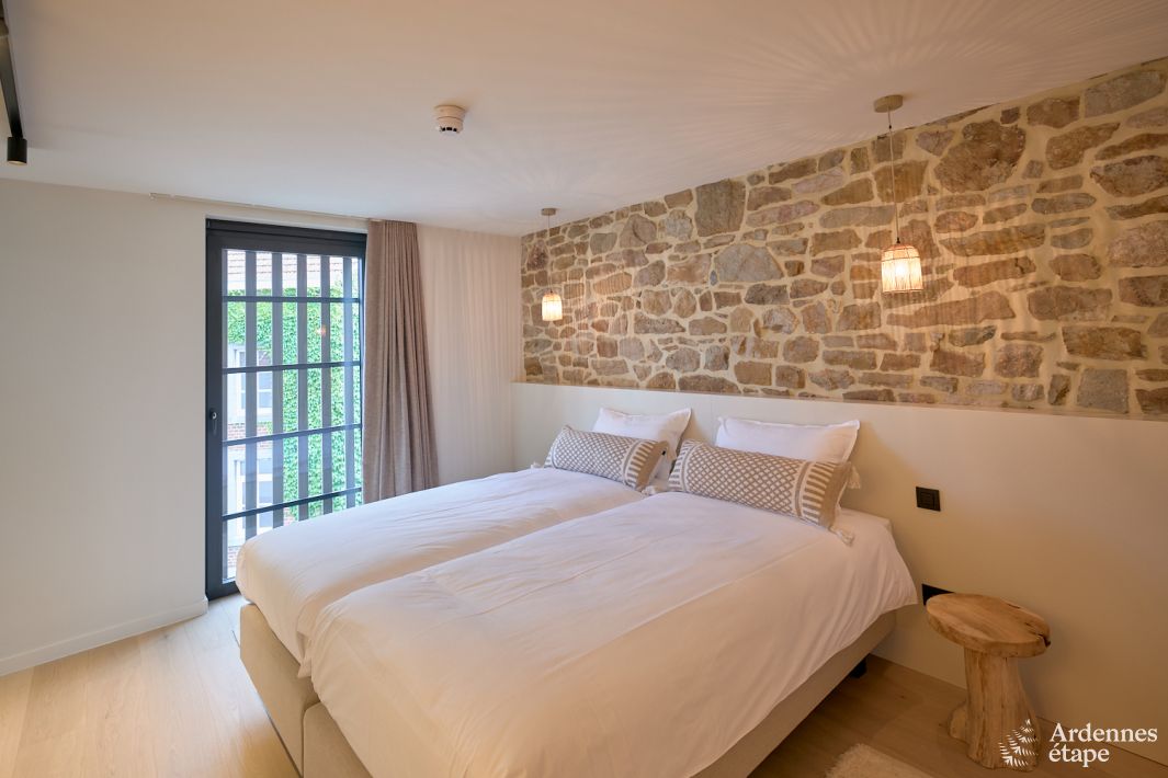 Le Supra - Chambre mur pierre